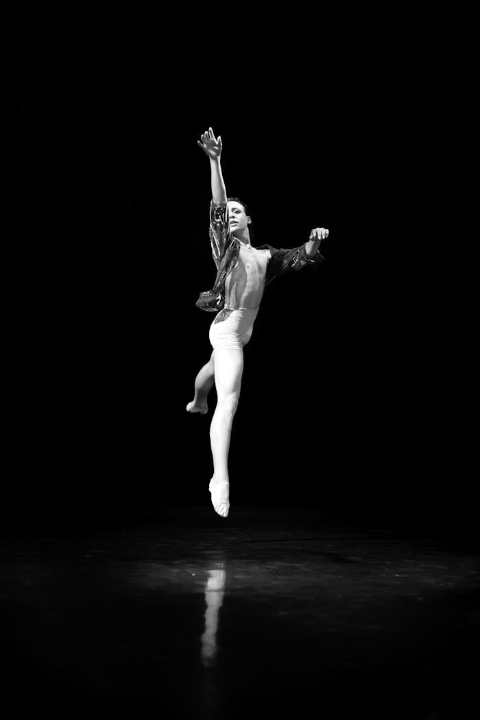 Grayscale Photography of Dancing Man